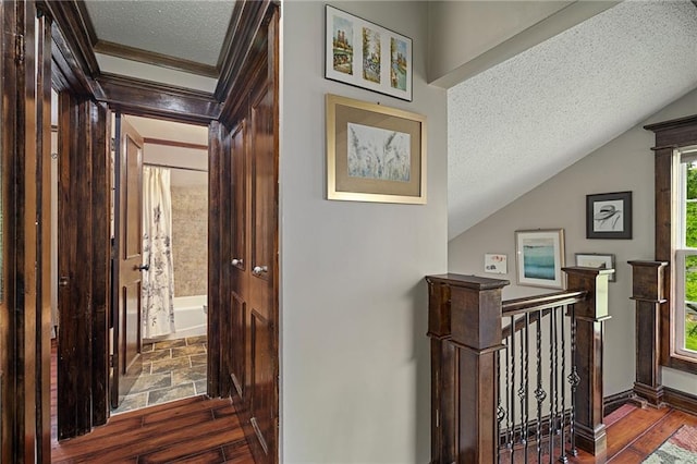 218 NE Bayview Dr, Lees Summit, MO 64064 - entrance foyer with wood-type flooring, a textured ceiling, ornamental molding, and baseboards