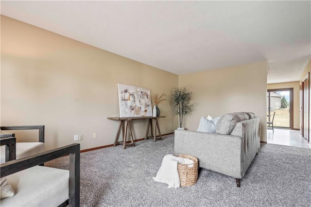 1109 Jeff Cir, Paola, KS 66071 - carpeted living area with baseboards and a textured ceiling