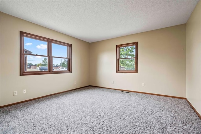 1109 Jeff Cir, Paola, KS 66071 - carpeted spare room featuring baseboards and a textured ceiling
