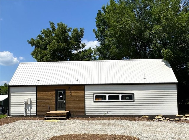 258 Sycamore Dr, Linn Valley, KS 66040 - view of front of property featuring a metal roof and gravel driveway