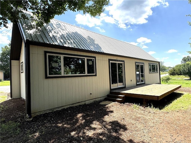 258 Sycamore Dr, Linn Valley, KS 66040 - rear view of house featuring a deck and a metal roof