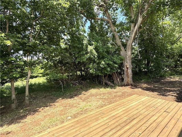 258 Sycamore Dr, Linn Valley, KS 66040 - deck featuring view of wooded area