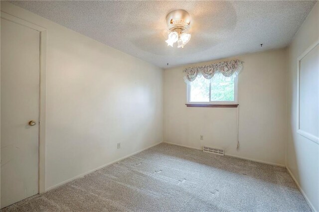 8713 Old Stagecoach Rd, Kansas City, MO 64154 - empty room with carpet flooring, a textured ceiling, and a ceiling fan