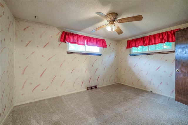 8713 Old Stagecoach Rd, Kansas City, MO 64154 - unfurnished room with carpet, a ceiling fan, and a textured ceiling