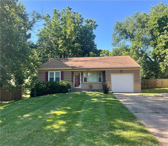 1445 E 77th St, Kansas City, MO 64131 - single story home with concrete driveway and an attached garage
