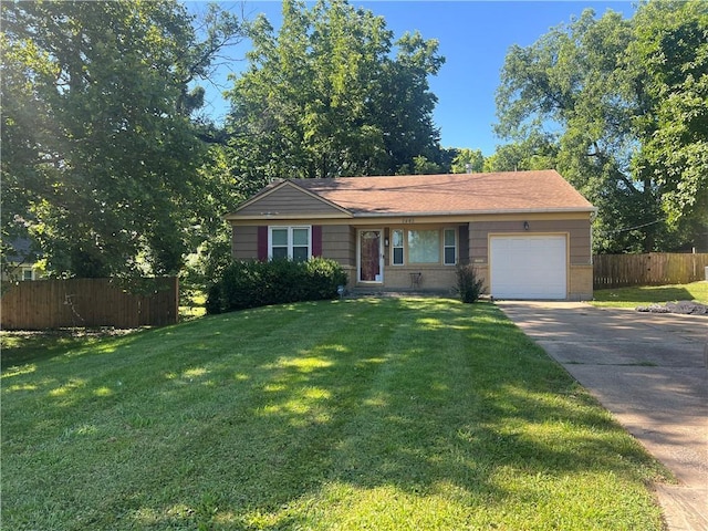 1445 E 77th St, Kansas City, MO 64131 - ranch-style home featuring driveway and an attached garage