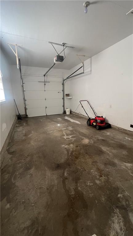 1445 E 77th St, Kansas City, MO 64131 - garage with a garage door opener
