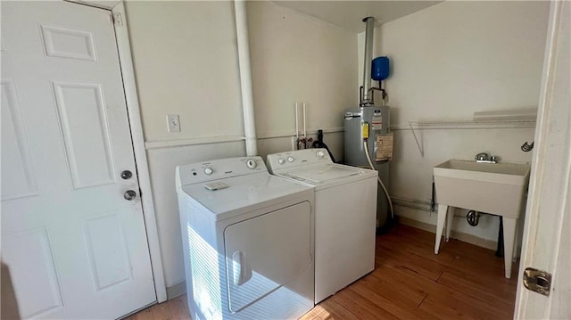 1445 E 77th St, Kansas City, MO 64131 - laundry room with washer and dryer and wood finished floors