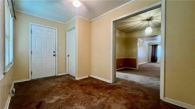 1445 E 77th St, Kansas City, MO 64131 - carpeted entryway with crown molding and ceiling fan