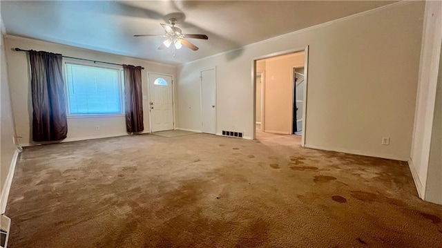 1445 E 77th St, Kansas City, MO 64131 - carpeted spare room with ceiling fan and crown molding