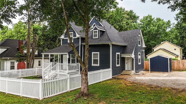 602 N College St, Richmond, MO 64085 - view of front of house with covered porch, entry steps, a shed, roof with shingles, and view of scattered trees
