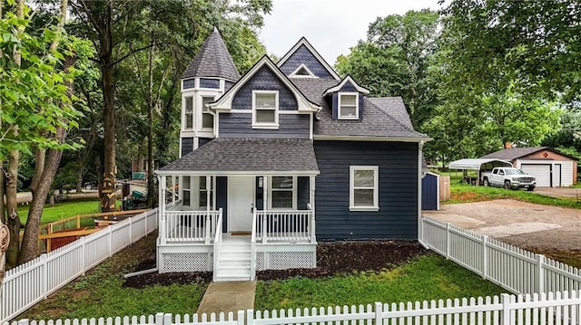 602 N College St, Richmond, MO 64085 - view of front of house with covered porch, roof with shingles, and a garage