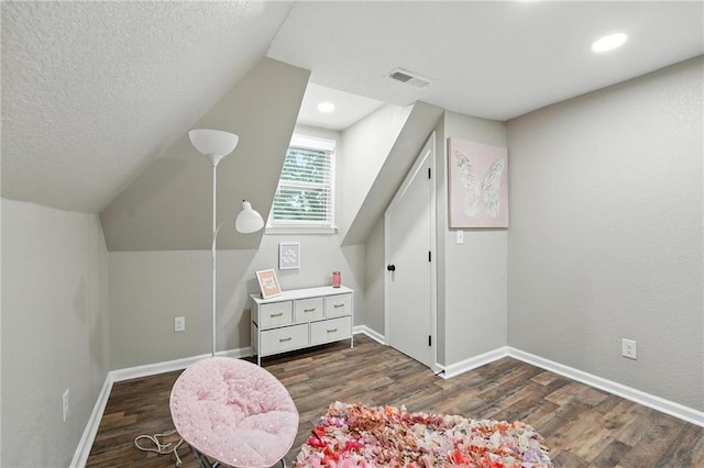 602 N College St, Richmond, MO 64085 - bonus room featuring wood finished floors, a textured ceiling, lofted ceiling, and recessed lighting
