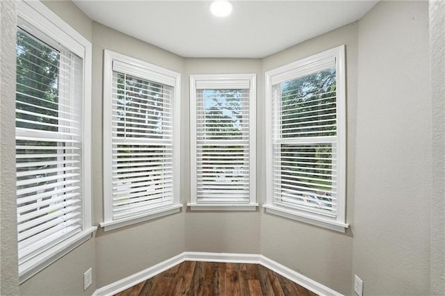 602 N College St, Richmond, MO 64085 - detailed view of baseboards and wood finished floors