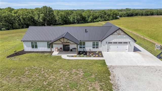 2363 Bainbridge Rd, Bates City, MO 64011 - modern inspired farmhouse with gravel driveway, a garage, board and batten siding, and a front yard