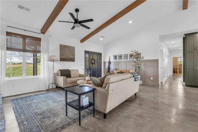 2363 Bainbridge Rd, Bates City, MO 64011 - living area with healthy amount of natural light, ceiling fan, beam ceiling, concrete flooring, and recessed lighting