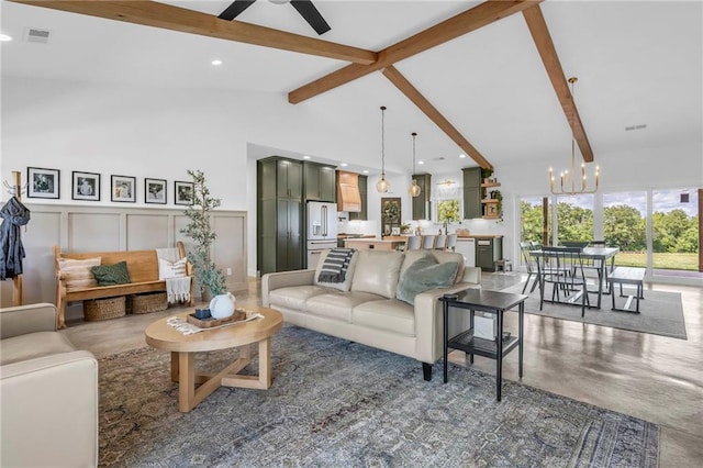 2363 Bainbridge Rd, Bates City, MO 64011 - living room with a chandelier, beam ceiling, concrete flooring, a ceiling fan, and a decorative wall