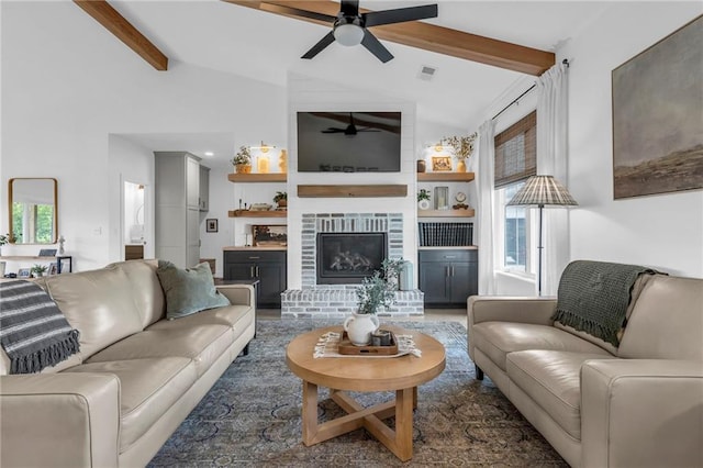 2363 Bainbridge Rd, Bates City, MO 64011 - living room featuring a ceiling fan and a fireplace