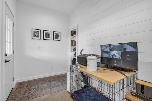 2363 Bainbridge Rd, Bates City, MO 64011 - office with baseboards, concrete flooring, and wooden walls