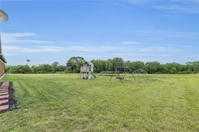 2363 Bainbridge Rd, Bates City, MO 64011 - view of grassy yard featuring a playground