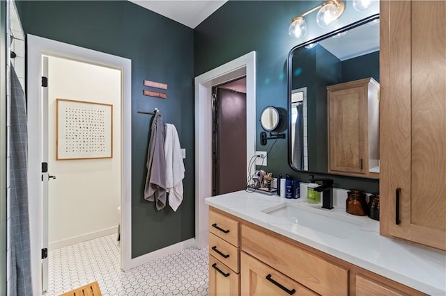 2363 Bainbridge Rd, Bates City, MO 64011 - bathroom with vanity, tile patterned floors, and baseboards
