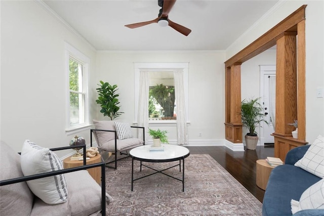 1795 S Norwood Ave, Independence, MO 64052 - living area featuring wood finished floors, a ceiling fan, baseboards, and ornamental molding