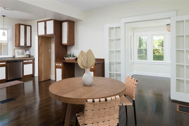1795 S Norwood Ave, Independence, MO 64052 - dining room featuring dark wood-type flooring and baseboards