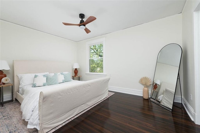1795 S Norwood Ave, Independence, MO 64052 - bedroom with wood finished floors, baseboards, and ceiling fan
