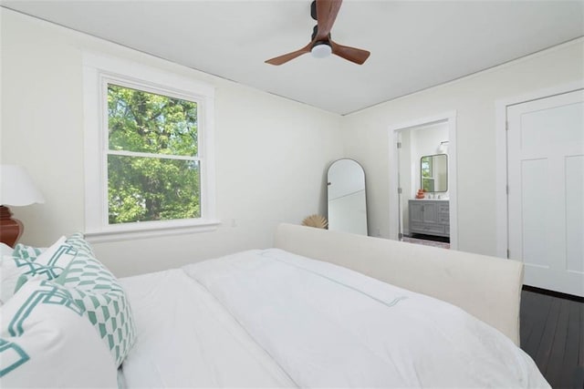 1795 S Norwood Ave, Independence, MO 64052 - bedroom featuring wood finished floors, connected bathroom, and a ceiling fan