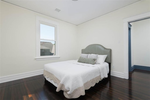 1795 S Norwood Ave, Independence, MO 64052 - bedroom featuring baseboards and wood finished floors