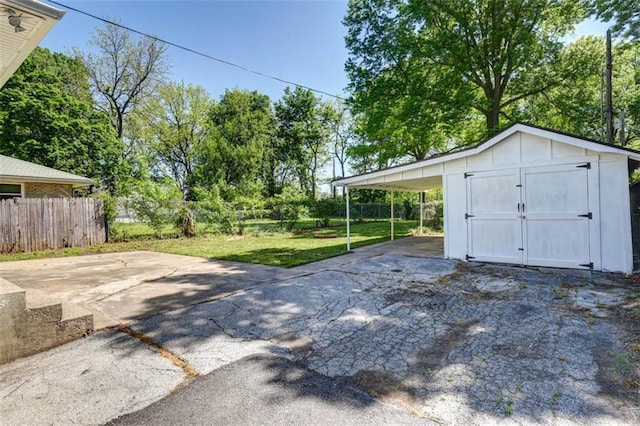 1795 S Norwood Ave, Independence, MO 64052 - garage with a storage shed and driveway