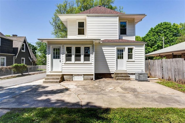 1795 S Norwood Ave, Independence, MO 64052 - back of property featuring entry steps, central air condition unit, and a patio