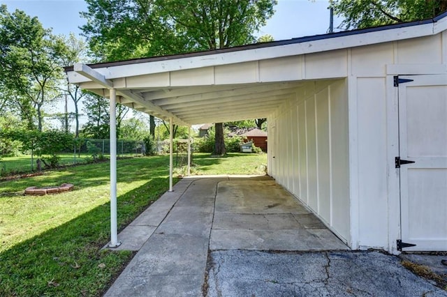 1795 S Norwood Ave, Independence, MO 64052 - view of car parking with a storage shed and driveway