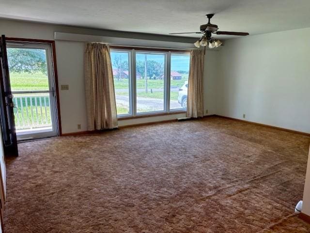 22025 Ness Rd, Parsons, KS 67357 - carpeted empty room with healthy amount of natural light, ceiling fan, and baseboards