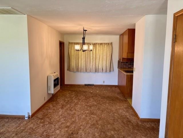 22025 Ness Rd, Parsons, KS 67357 - unfurnished dining area featuring heating unit, a chandelier, carpet, and baseboards