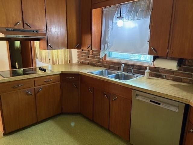 22025 Ness Rd, Parsons, KS 67357 - kitchen featuring stainless steel dishwasher, a sink, black electric cooktop, under cabinet range hood, and light countertops