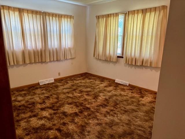 22025 Ness Rd, Parsons, KS 67357 - carpeted empty room featuring baseboards