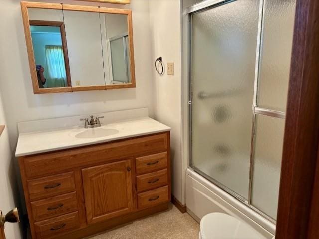 22025 Ness Rd, Parsons, KS 67357 - full bath with toilet, bath / shower combo with glass door, and vanity
