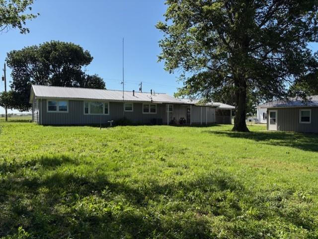 22025 Ness Rd, Parsons, KS 67357 - rear view of property with a yard