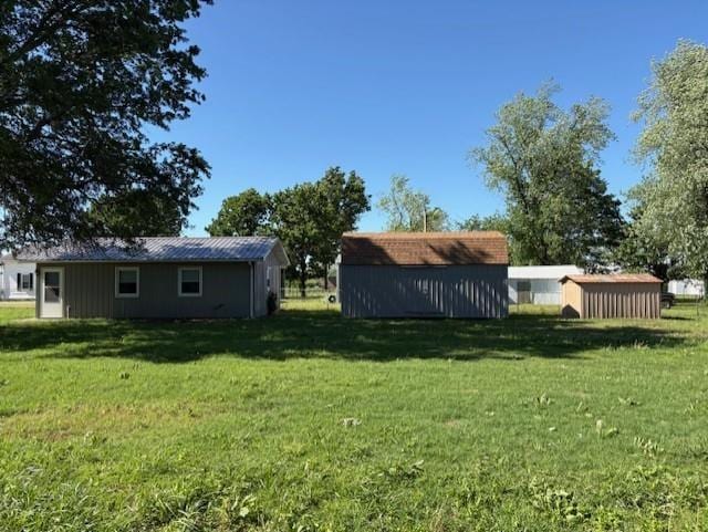 22025 Ness Rd, Parsons, KS 67357 - view of grassy yard with an outbuilding