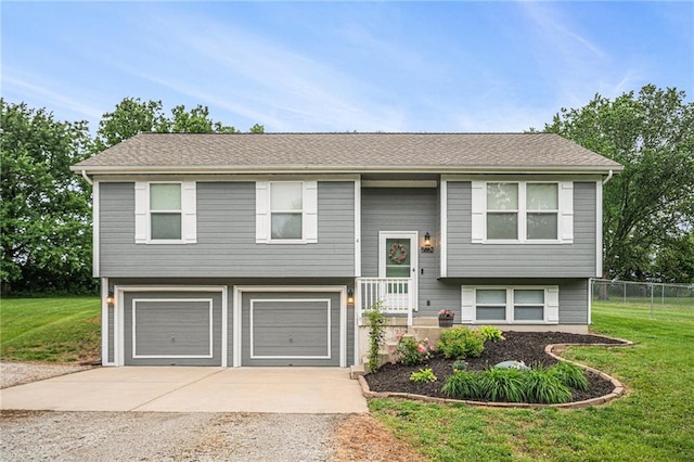 5862 SW Reed Ln, Trimble, MO 64492 - split foyer home with concrete driveway and an attached garage