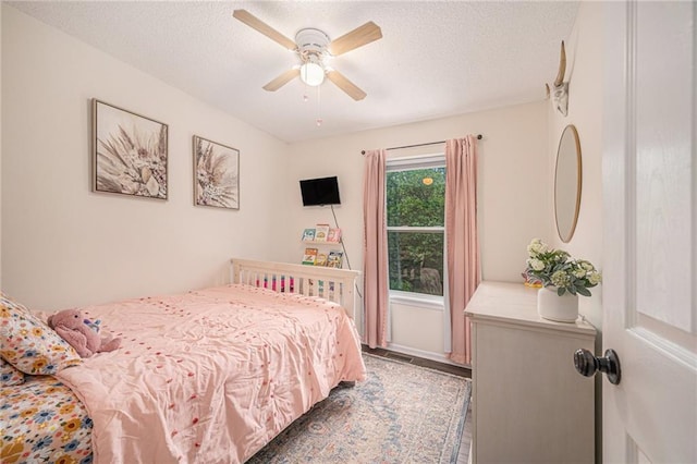 5862 SW Reed Ln, Trimble, MO 64492 - bedroom with a textured ceiling and ceiling fan