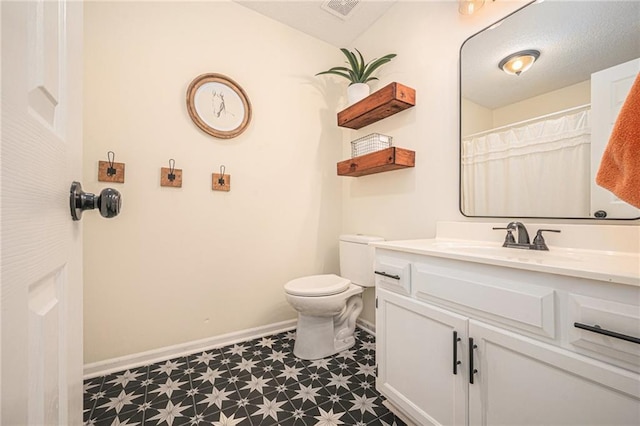 5862 SW Reed Ln, Trimble, MO 64492 - bathroom featuring tile patterned floors, baseboards, vanity, and toilet