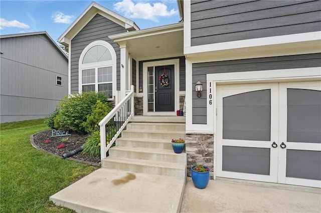 1106 E 14th St, Kearney, MO 64060 - view of exterior entry featuring stone siding and a yard