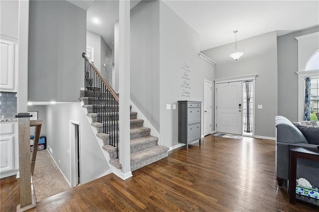 1106 E 14th St, Kearney, MO 64060 - entryway with dark wood-style floors, stairway, and baseboards