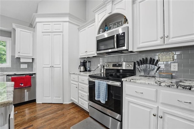 1106 E 14th St, Kearney, MO 64060 - kitchen with appliances with stainless steel finishes, backsplash, white cabinetry, and dark wood-type flooring