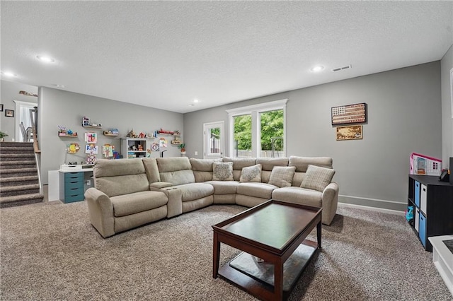 1106 E 14th St, Kearney, MO 64060 - carpeted living area with a textured ceiling, recessed lighting, and stairs