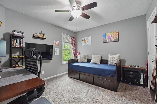 1106 E 14th St, Kearney, MO 64060 - carpeted bedroom featuring baseboards, ceiling fan, and a textured ceiling