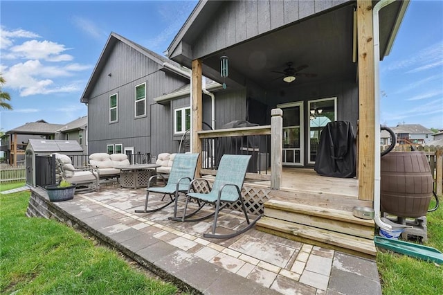 1106 E 14th St, Kearney, MO 64060 - back of house featuring a ceiling fan, a deck, a patio area, and an outdoor hangout area