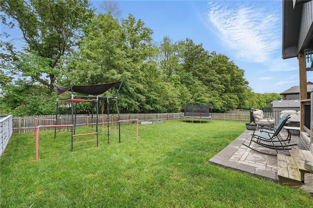 1106 E 14th St, Kearney, MO 64060 - view of yard with a trampoline, a patio area, and a playground
